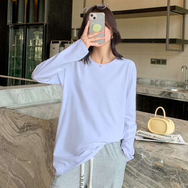 Široki model ženske bluze dugih rukava i ovalnog dekoltea