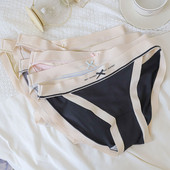 Varrat nélküli női bugyi szalaggal