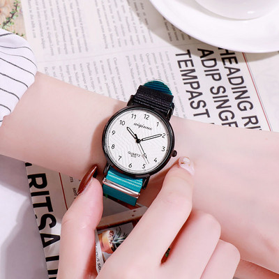 Vyriškas laikrodis su apvaliu ciferblatu ir tekstiliniu dirželiu