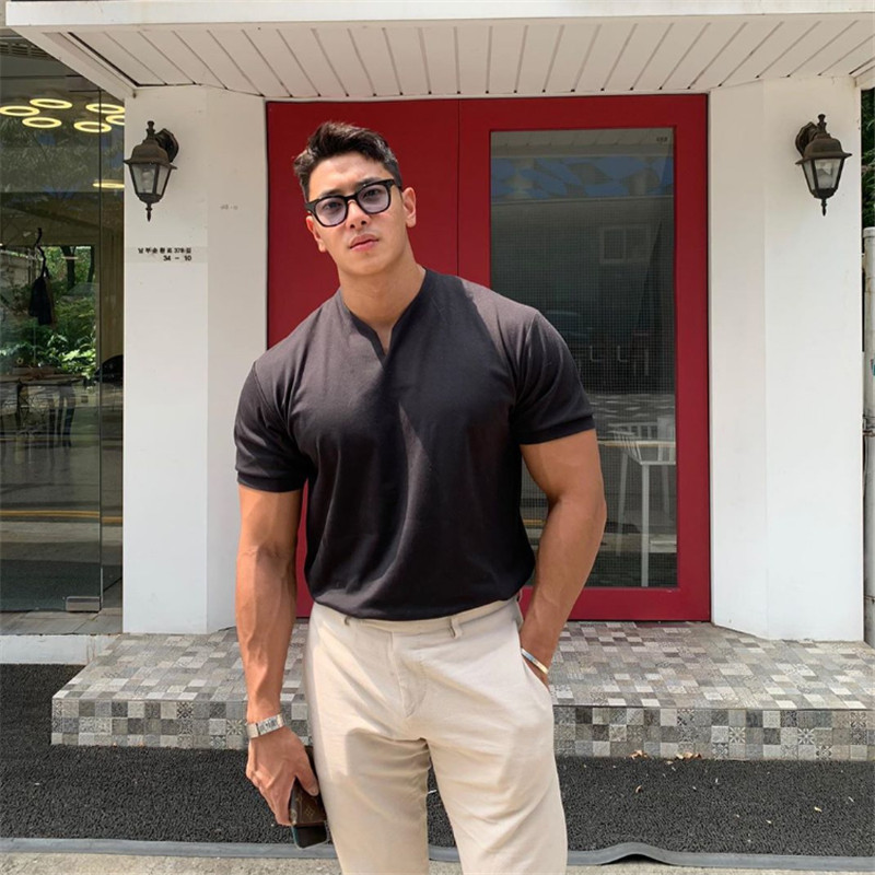 Ležerna majica kratkih rukava Muškarci Gyms Fitness T-shirt Muškarci Trening Vježbanje Pamučne tanke majice Topovi Nova bijela moda Odjeća M-5xl