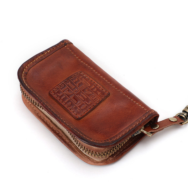 Odinė vyriška piniginė tinkanti raktams ir kreditinėms kortelėms laikyti