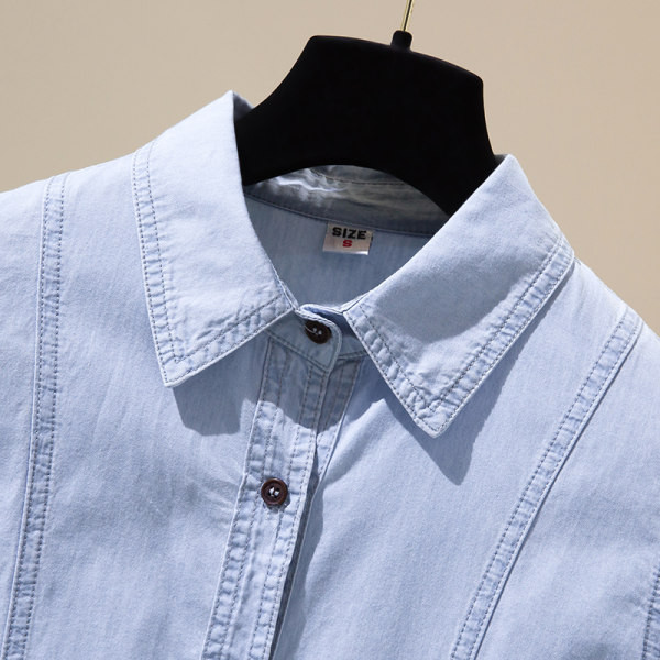 Moteriški džinsiniai marškiniai su sagomis