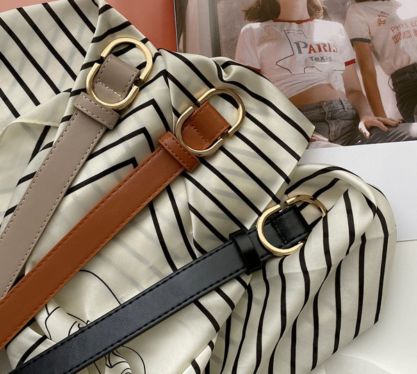 Ležeran ženski remen sa metalnom kopčom