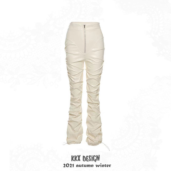 Baltos plonos odinės kelnės