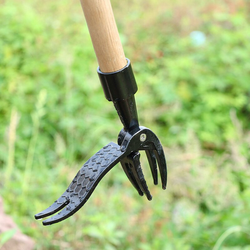 Pjovimo mašina, valdoma koja, stovinčioji ravėjimo galvutė, pakeičiama stovima metalinė piktžolių ištraukimo priemonė, skirta lauke naikinti piktžoles