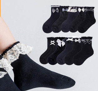 Children`s socks with lace or ribbons for girls