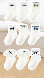 Children`s socks with ribbon and lace