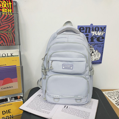 Pánsky textilný batoh s logom a prednými vreckami na zips