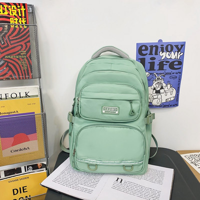 Pánsky textilný batoh s logom a prednými vreckami na zips