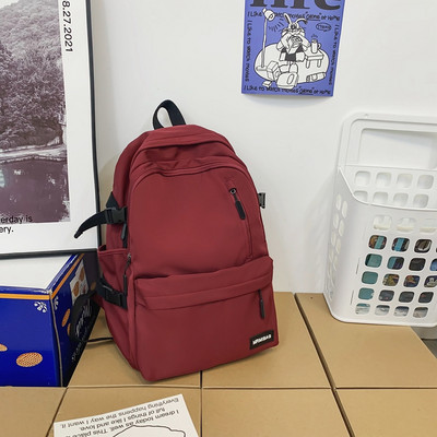 Muški ležerni tekstilni ruksak s logotipom i prednjim džepom