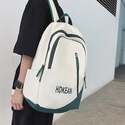 Muški ruksak sa patentnim zatvaračima i natpisom