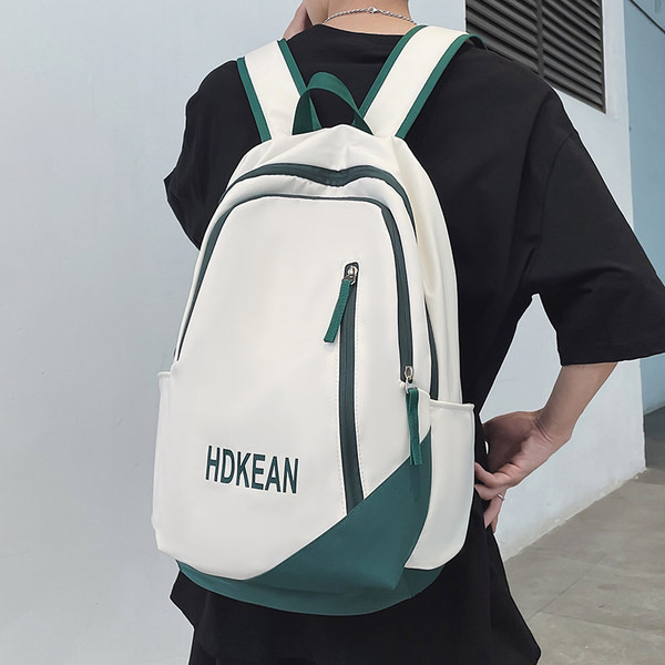 Muški ruksak sa patentnim zatvaračima i natpisom