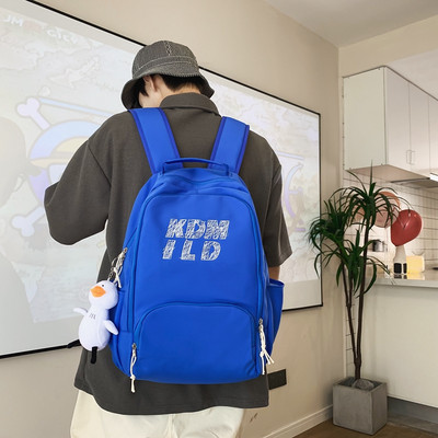 Muški ležerni ruksak s privjeskom za ključeve i natpisom