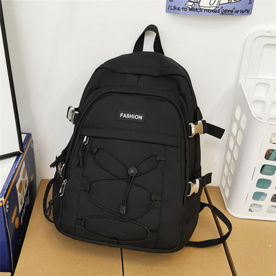 Pánsky textilný batoh s prednými zaväzovaniami na vreckách a nápisom