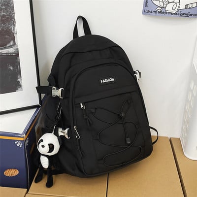 Pánsky textilný batoh s prednými zaväzovaniami na vreckách a nápisom