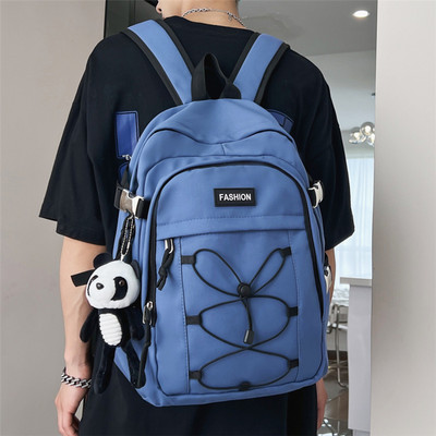 Pánsky textilný batoh s prednými zaväzovaniami na vreckách a nápisom