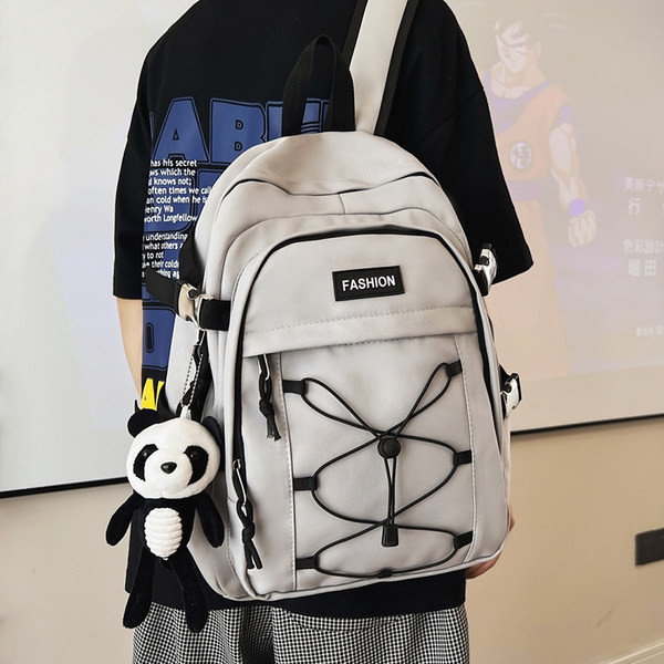 Pánsky textilný batoh s prednými zaväzovaniami na vreckách a nápisom