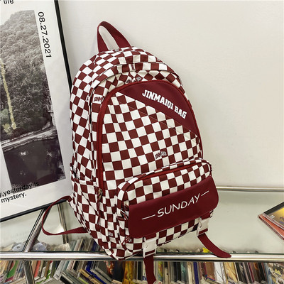 Pánsky batoh s figúrkami a nápisom