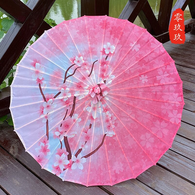 Naiste vihmavari Siidist õues Jaapani kirsiõied iidse tantsu pulma dekoratiivne vihmavari Hiina stiilis õlipaberist vihmavari