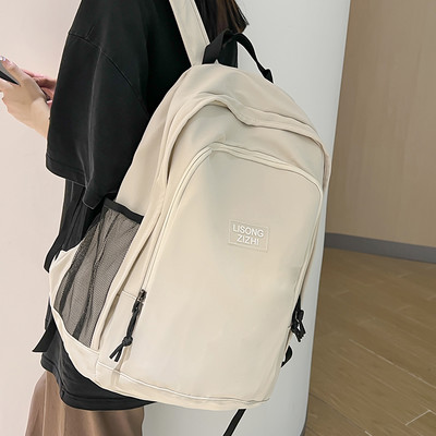 Pánsky ležérny textilný batoh s nápisom a bočnými vreckami