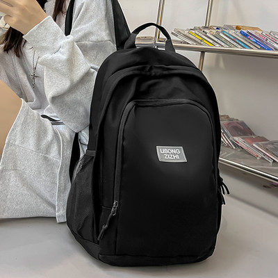 Pánsky ležérny textilný batoh s nápisom a bočnými vreckami