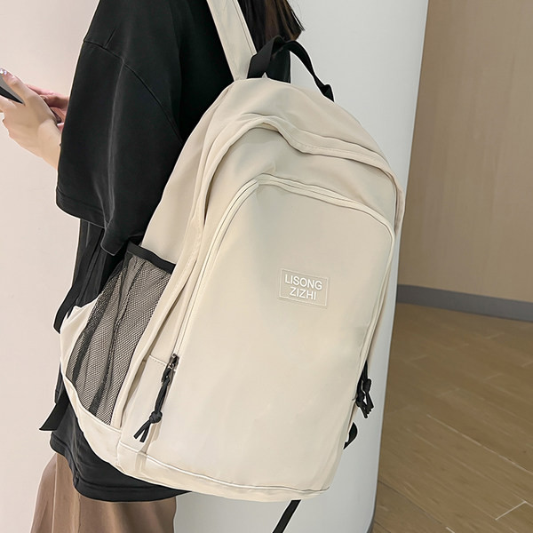 Pánsky ležérny textilný batoh s nápisom a bočnými vreckami