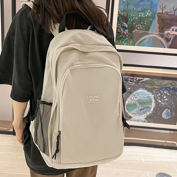 Pánsky ležérny textilný batoh s nápisom a bočnými vreckami