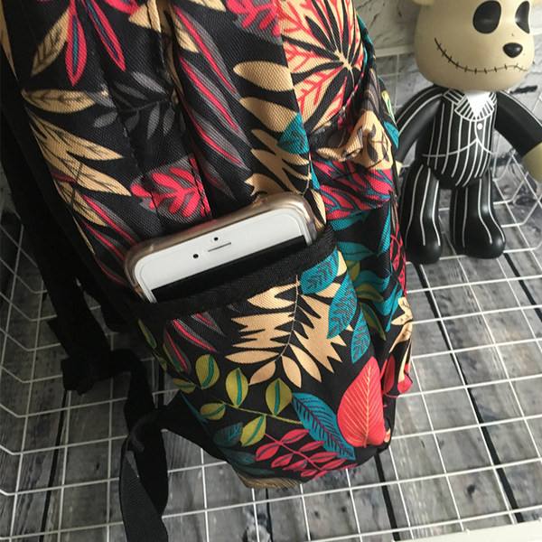 Vyriška kuprinė su gėlių motyvais