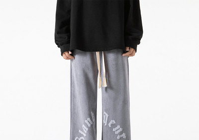 Pánske nohavice širokého modelu s nápisom