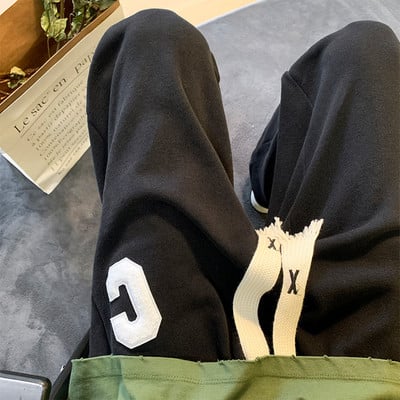 Pánske tepláky s výšivkou