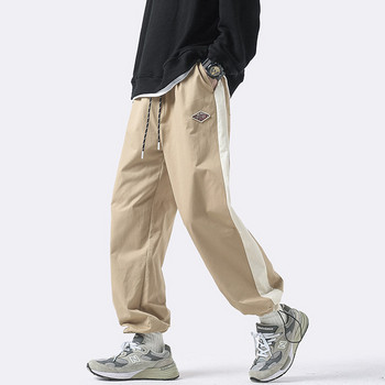Мъжки спортен панталон с връзки на крачолите и емблема