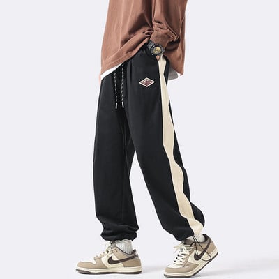 Pantaloni de trening pentru bărbați cu legături la picioare și logo