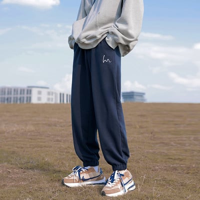 Pánske športové nohavice s gumou na nohaviciach a vreckom