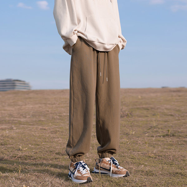 Pánske športové nohavice s gumou na nohaviciach a vreckom