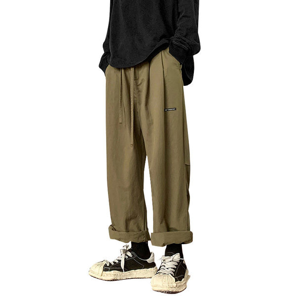 Pánske nohavice voľného strihu so šnúrkami a nápisom