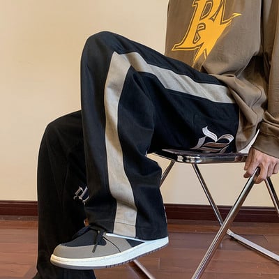 Pánske nohavice s lemovaním a nápisom