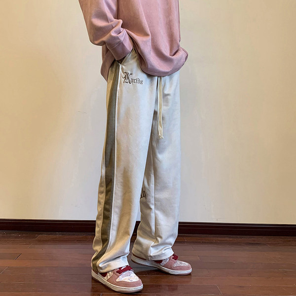 Pánske nohavice s lemovaním a nápisom