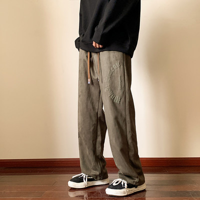 Nový model pánskych športových nohavíc s nápisom