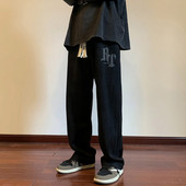 Pánske nohavice voľného strihu so šnúrkami a nápisom