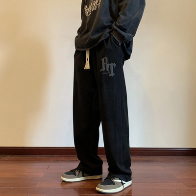 Pánske nohavice voľného strihu so šnúrkami a nápisom