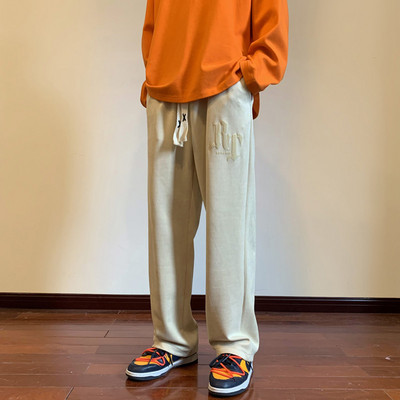 Pánske nohavice voľného strihu so šnúrkami a nápisom