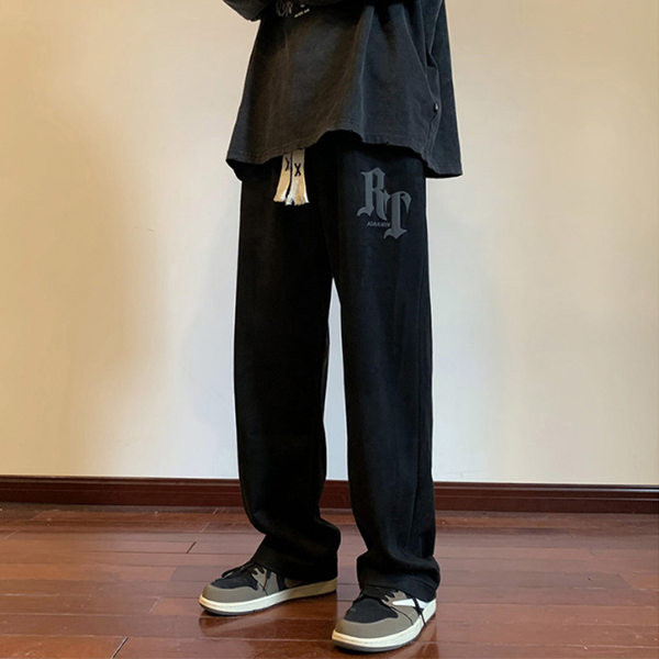 Pánske nohavice voľného strihu so šnúrkami a nápisom