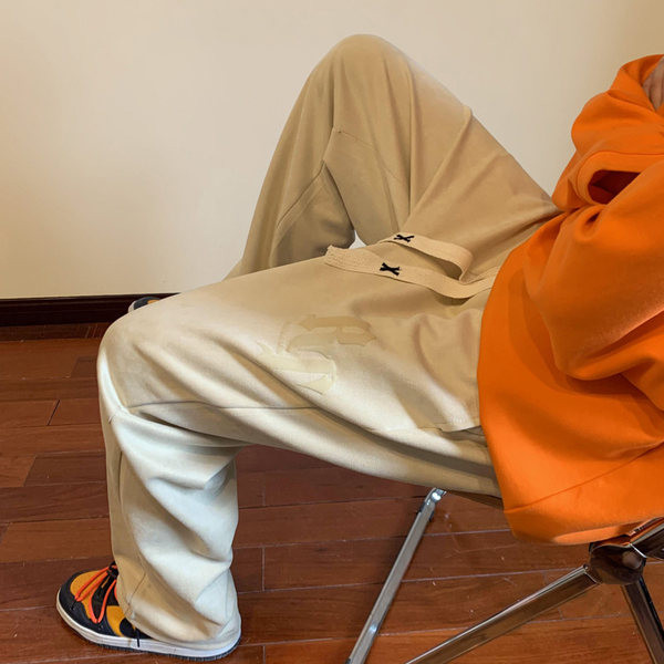 Pánske nohavice voľného strihu so šnúrkami a nápisom