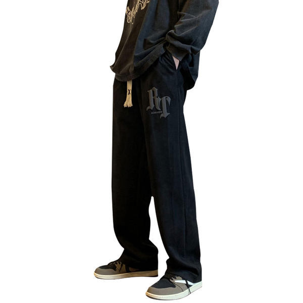 Pánske nohavice voľného strihu so šnúrkami a nápisom