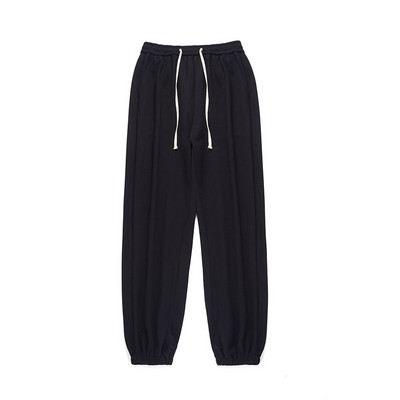 Pantaloni sport monocolor cu picioare elastice și șireturi