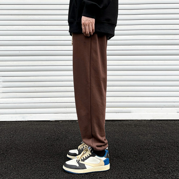 Pantaloni sport monocolor cu picioare elastice și șireturi