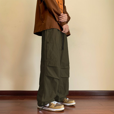 Pánske nohavice širokého modelu s vysokým pásom, zaväzovaním a vreckom