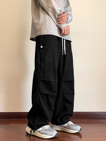 Pánske nohavice širokého modelu s vysokým pásom, zaväzovaním a vreckom