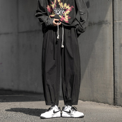 Pantaloni casual cu sireturi si picioare elastice