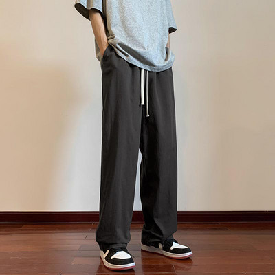 Moderné pánske nohavice s vreckami a šnúrkami rovného strihu